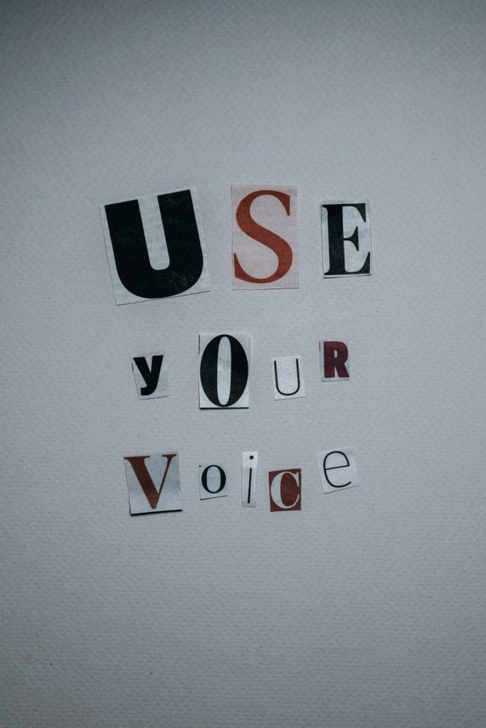 Use Your Voice inscription on gray background